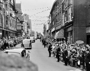 The Queen's cavalcade travelling through Shrewsbury on March 17, 1967, being cheered by crowds. 