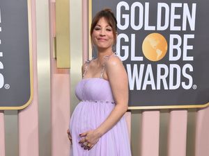 Supporting image for story: Kaley Cuoco debuts growing baby bump on Golden Globes red carpet