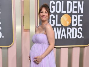 Supporting image for story: Kaley Cuoco debuts growing baby bump on Golden Globes red carpet