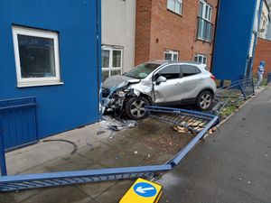 Supporting image for story: Emergency services rush to city road after car crashes into building