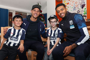 Kieran Gibbs and Darnell Furlong with Alex and William Bayley. Photo: AMA