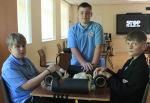 Learning life-saving skills at the Stop The Bleed training session are (from left) King Edward VI School Year 7 pupils Archie, Macauley and James.

