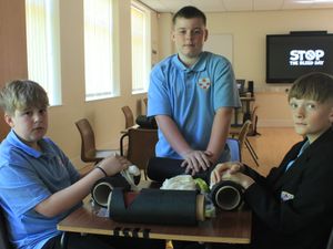 Learning life-saving skills at the Stop The Bleed training session are (from left) King Edward VI School Year 7 pupils Archie, Macauley and James.

