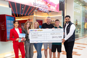 Winner of QRious Quest, David Hodge collects his prize from Virgin Atlantic Holidays
and Mo Shirazi, Operations Manager at Merry Hill