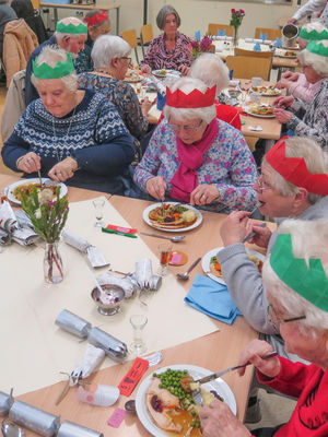 Senior citizens tucking into their dinners