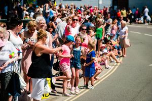 Crowds line the streets to greet the floats