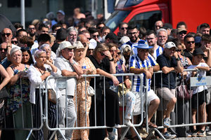 Public mourners gather at the funeral