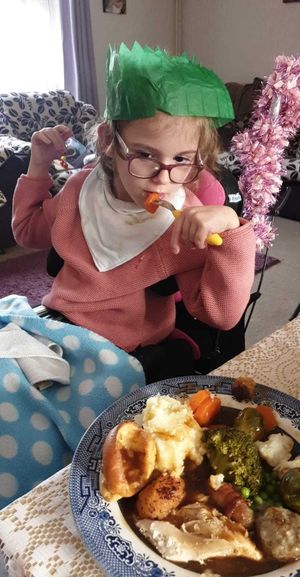 Aimee enjoying her Christmas dinner in 2018 - thanks to Acorns Children's Hospice