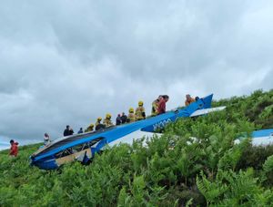 Supporting image for story: Fire chief recalls glider rescue effort to free pair trapped in upturned aircraft on hill