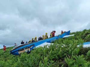 Supporting image for story: Fire chief recalls glider rescue effort to free pair trapped in upturned aircraft on hill