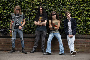 Music fans (L-R) Ethan Quinney, Arron Jacobs, Harry Evans, Sean Demanski arrive to attend British rock band Black Sabbath's "Back to The Beginning" concert, Ozzy Osbourne's final ever gig as Black Sabbath's frontman at Villa Park in Birmingham, central England on July 5, 2025. Osbourne, who revealed in 2020 that he has Parkinson's disease, will join Tony Iommi, Geezer Butler and Bill Ward for the all-day "Back To The Beginning" show in Birmingham, central England, where the heavy metal giants formed in 1968. (Photo by Oli SCARFF / AFP) (Photo by OLI SCARFF/AFP via Getty Images)          