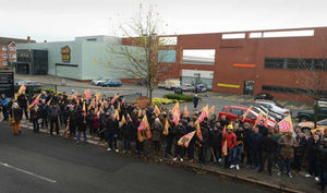 Firefighters demonstrate outside West Midlands Fire Service headquarters in Birmingham