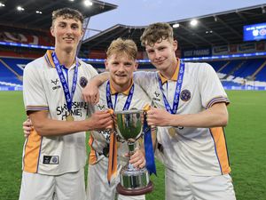 Karsten Cairns (left), Jack Loughran and Joe Morris of Shrewsbury Town celebrate with the Professional Development League Trophy
