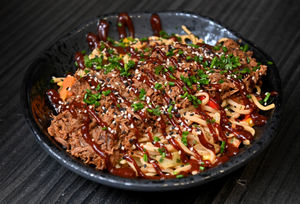 Pictured is BBQ shredded beef and egg noodle stir fry
