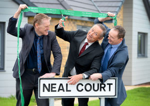 Cutting the ribbon, from left, Quentin, Jonathan, and Toby Neal.
