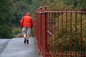 A walker braves the rain in Ironbridge on Saturday