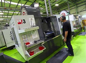 Adrian Dudok operating a CNC machining centre