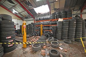 DUDLEY COPYRIGHT TIM STURGESS NATIONAL WORLD 10/02/25. The hold in the roof of Lye Tyres, which amazingly was still open for business on Monday