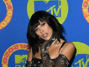 Supporting image for story: Doja Cat wears moustache and beard made of false eyelashes at Paris Fashion Week