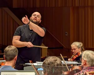 Jack Lovell-Huckle conducting the Birmingham Philharmonic Orchestra