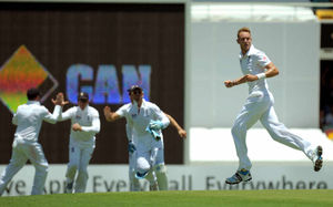 England's Stuart Broad (right) celebrates taking the wicket of Australia's Shane Watson