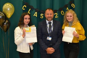 Students Katie Jarvis and Sydney Cattell with principal Chay Davis