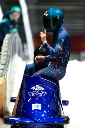  Pilot Adele Nicoll and Ashleigh Nelson of Team Great Britain celebrate after competing in the Bobsleigh Two-Woman Heat 4 on day fifteen of the Milano Cortina 2026 Winter Olympic games at Cortina Sliding Centre on February 21, 2026 in Cortina d'Ampezzo, Italy. (Photo by Ezra Shaw/Getty Images)