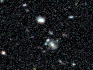 An image from the Hubble Space Telescope which shows a small smudge, centre, that astronomers believe is the oldest thing they have ever seen, light from a long time ago in a galaxy far, far away