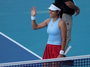 Emma Raducanu waves to the crowd in Miami