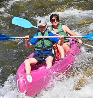 Jamie and Sally-Anne Youll take on the rapids in a canoe