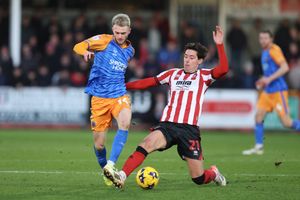 Taylor Perry of Shrewsbury Town and Isaac Hutchinson of Cheltenham Town