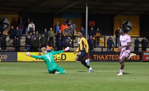 Debutant Shrewsbury Town goalkeeper Matt Cox rushes out to thwart former Salop loanee Sullay Kaikai (Picture: Ben Phillips)