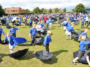Supporting image for story: Dry run for pupils' brolly good record attempt