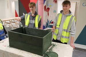 Construction students Lucas Davies and Tyler Klimkowski building the planters.