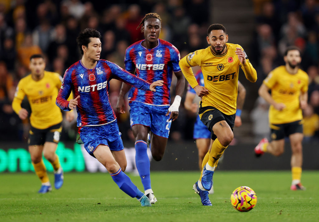 Matheus Cunha of Wolverhampton Wanderers runs with the ball under pressure from Daichi Kamada(Photo by Jack Thomas - WWFC/Wolves via Getty Images)