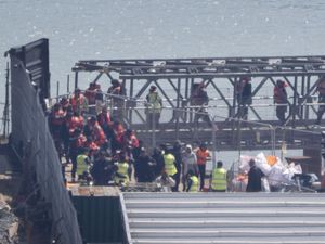A group of people thought to be migrants are brought in to Dover