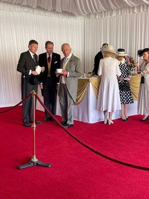 King Charles III taking tea in The Royal Tea Tent