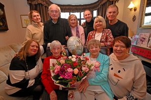 Margaret and Dot pose with their daughters, left, Suzanne Johnson and Mandy Jordan and other members of the family