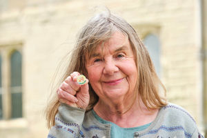 Children's author, Julia Donaldson, holds a new 50p coin by The Royal Mint at Warwick Castle, that celebrates the children's character Zog.