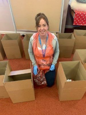 Stacey Kerr helping assemble the boxes