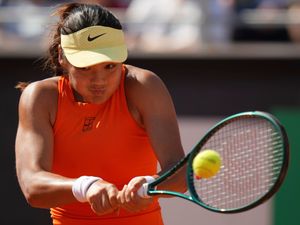 Emma Raducanu plays a backhand against Coco Gauff