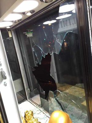 A smashed window after the raid