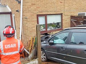 Supporting image for story: Hole left in family's home after crash