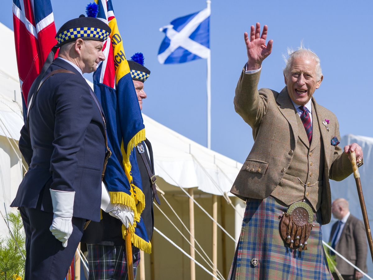 King enjoys dram of whisky at Highland Games