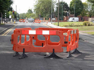 Supporting image for story: Road shut as hole opens up