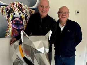 Supporting image for story: Wolves legend Steve Bull's silver wolf finds home in Steel City