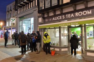 Customers queue outside of Alice's tea rooms