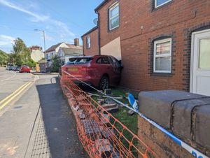 The Jaguar remained wedged in the house in Hadley on Monday (July 14)