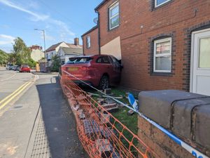Supporting image for story: Driver taken to hospital as 'precaution' after Jaguar SUV smashed into Telford house