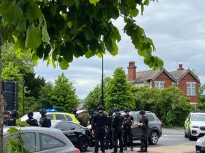 Supporting image for story: Armed police surround sports car and arrest two men after attempted robbery